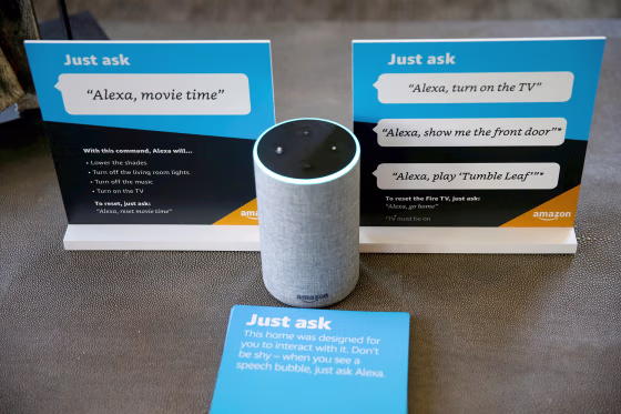 Image: Prompts on how to use Amazon's Alexa personal assistant are seen alongside an Amazon Echo in an Amazon ?EUR~experience center?EUR(TM)  in Vallejo