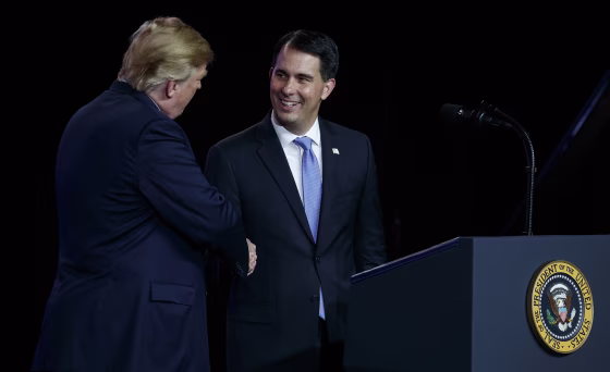Image: President Donald Trump shakes hands with Gov. Scott Walker, R-Wis.