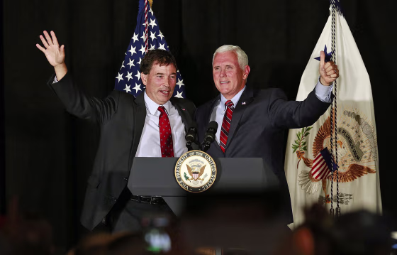 Vice President Mike Pence waves to the crowd with 12th Congressional District Republican candidate Troy Balderson during a rally Monday in Newark, Ohio.