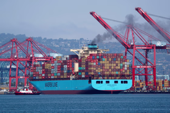 Image: A Maersk Line container ship prepares to depart port in Long Beach, California