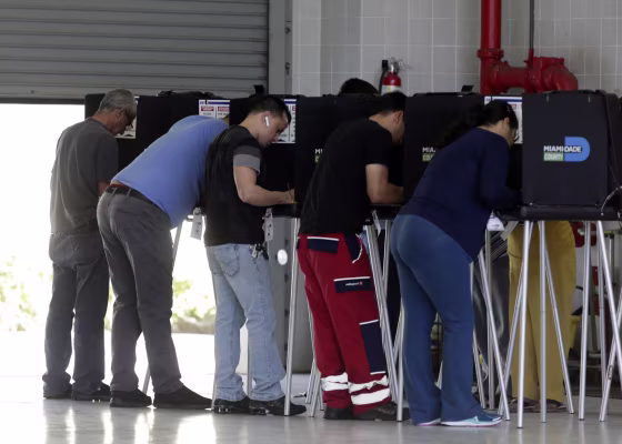People vote inside a Miami-Dade County fire station on election day