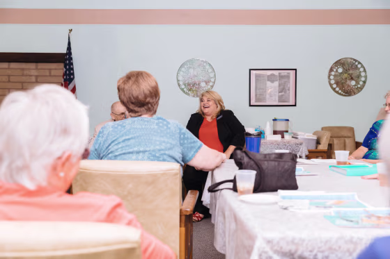 Image: Lesia Romanov speaks with guests during a meet-and-greet