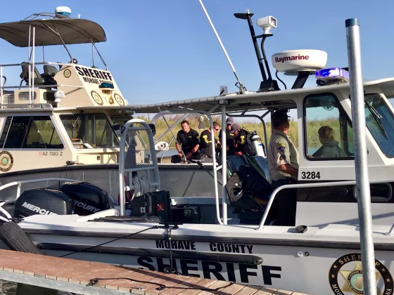 Image: Mohave County Sheriff's Office search and rescue boats look for four people missing on the Colorado River, north of Lake Havasu in Arizona