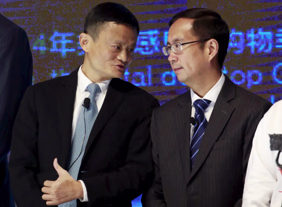 Image: FILE PHOTO: Alibaba Founder and Chairman Jack Ma talks to CEO Daniel Zhang at NYSE Bell Ringing ceremony during Alibaba Group's 11.11 Global shopping festival in Beijing
