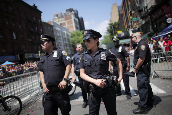 NYPD officers stand watch on Seventh Avenue during the annual Pride Parade on June 24, 2018 in New York City.