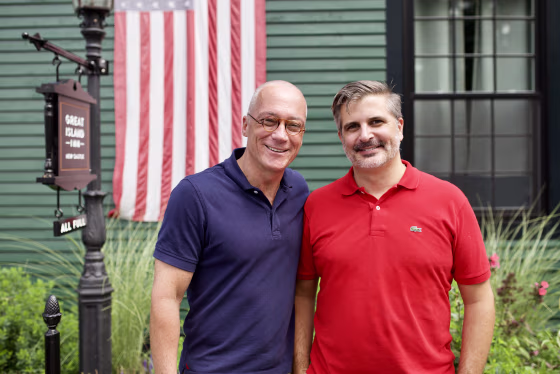 New Hampshire state Sen. Dan Innis, left, with his husband, Doug Palardy, outside the Great Island Inn, which they own, in New Castle, New Hampshire.