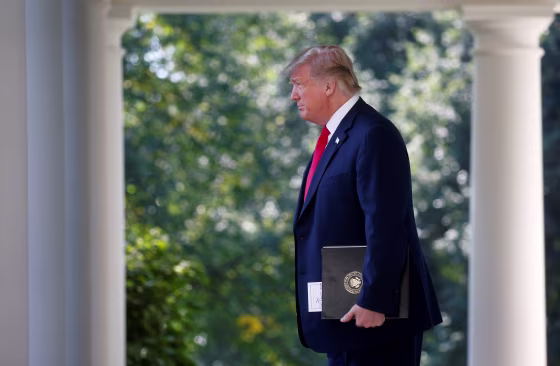 Image: President Trump arrives to announce trade deal in the Rose Garden of the White House in Washington