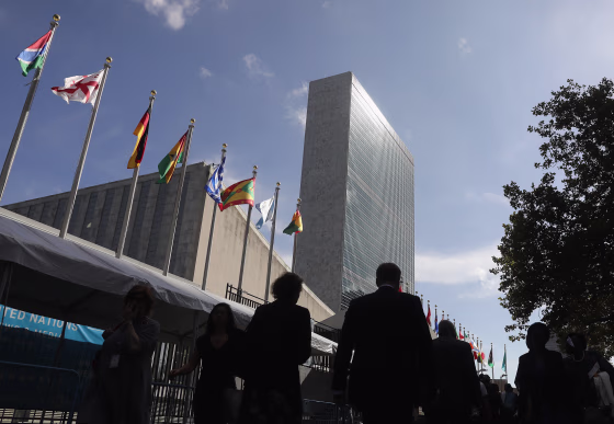 People walk past the United Nations headquarters