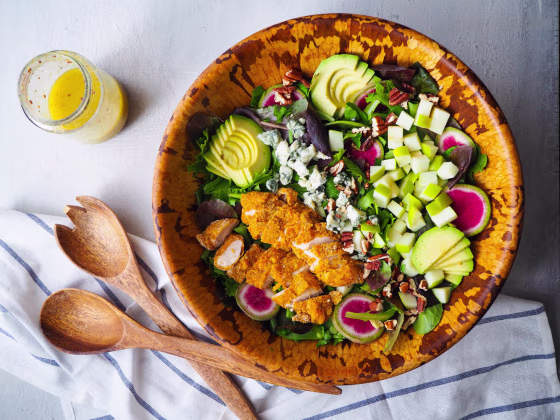 Give your salads a fall twist by adding sliced apples, like in this Harvest Salad with Crispy Cornmeal Chicken, Apples and Gorgonzola.