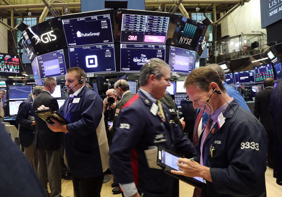 Traders work on the floor of the New York Stock Exchange (NYSE) on Oct. 15, 2018.