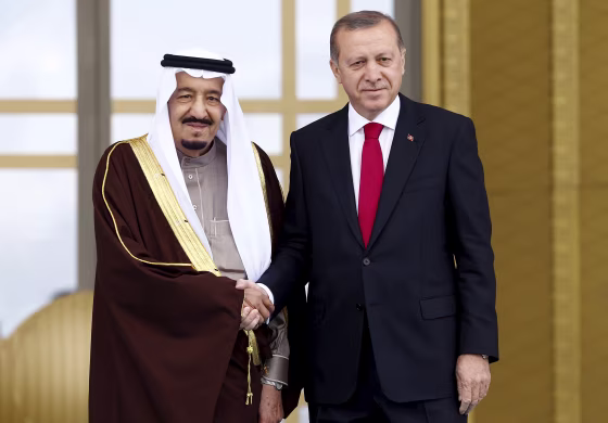 Image: Turkey's President Tayyip Erdogan and Saudi King Salman shake hands during a welcoming ceremony in Ankara, Turkey