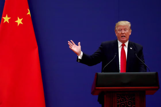 Image: U.S. President Donald Trump delivers his speech as he and China's President Xi Jinping meet business leaders at the Great Hall of the People in Beijing