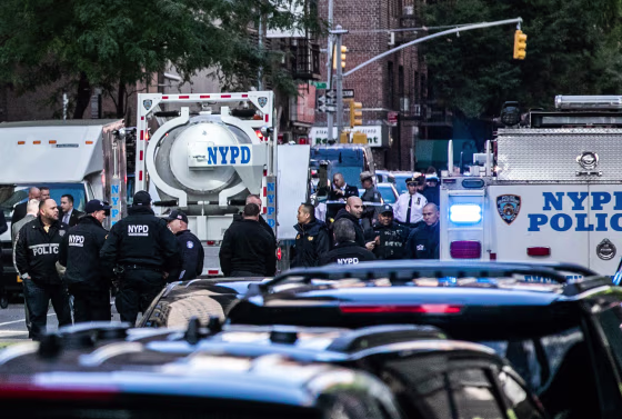 Image: Police investigators gather around a bomb squad truck outside the Time Warner Center in New York after the discovery of an explosive device at the CNN offices on Wednesday, Oct. 24, 2018.
