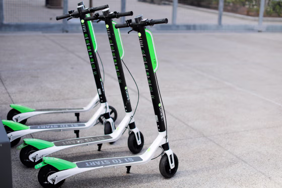 Image: Smart phone app time-of-use electric scooters from Lime-S are shown parked along a sidewalk in San Diego, California