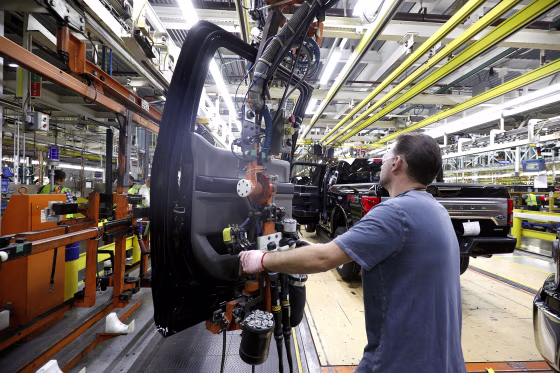 A Ford Motor Company workers works on a Ford F150 truck on the assembly line at the Ford Dearborn Truck Plant on Sept. 27, 2018 in Dearborn, Michigan.