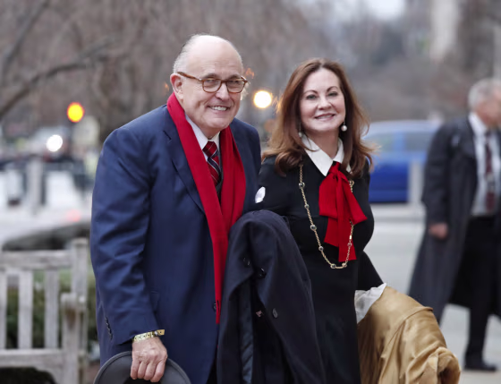 Rudy Giuliani and his wife, Judith Giuliani, arrive for a church service at St. John's Episcopal Church across from the White House on Jan. 20, 2017.
