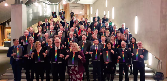 Members of Scottish Parliament pose with the symbol of the TIE campaign after announcing their LGBTI curriculum on Nov. 8, 2018.