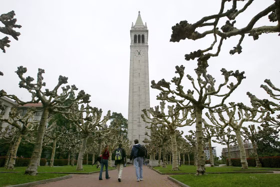Students walk near Sather Tower on the University of California at Berkeley campus in California.