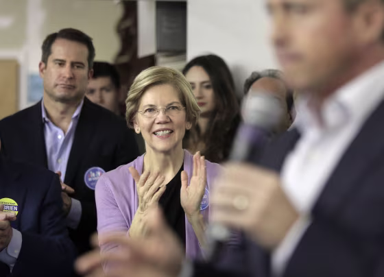 Image: Democrat U.S. Sen. Elizabeth Warren, center, applauds as Massachusetts gubernatorial candidate Jay Gonzalez addresses a crowd during a campaign stop