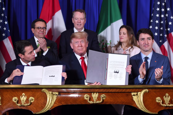 Mexico President Enrique Pena Nieto, left, President Donald Trump and Canadian Prime Minister Justin Trudeau sign a new free trade agreement at the G20 Leaders' Summit in Buenos Aires on Nov. 30, 2018.