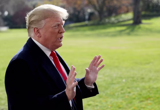 President Donald Trump answers questions from the press while departing the White House on Nov. 29, 2018.