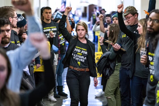 Image: Supporters of the \"Green New Deal\" rally inside the Longworth House Office Building in Washington on Dec. 10, 2018.