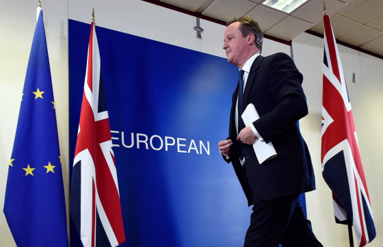 Image: British Prime Minister David Cameron leaves after delivering a press conference at a European Union (EU) summit in Brussels