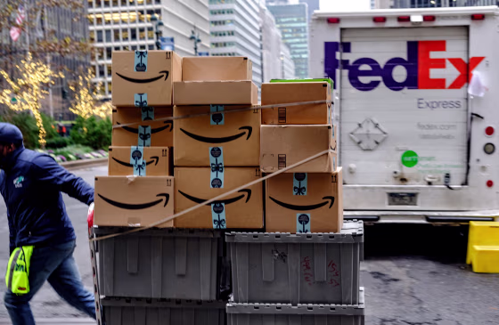 A worker handles Amazon packages in New York on Nov. 26, 2018.