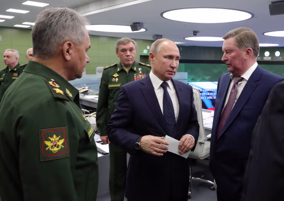 Image: Russian President Vladimir Putin speaks with staff and a special representative while overseeing a test launch of the Avangard hypersonic glide vehicle in the Defense Ministry control room in Moscow on Dec. 26, 2018.