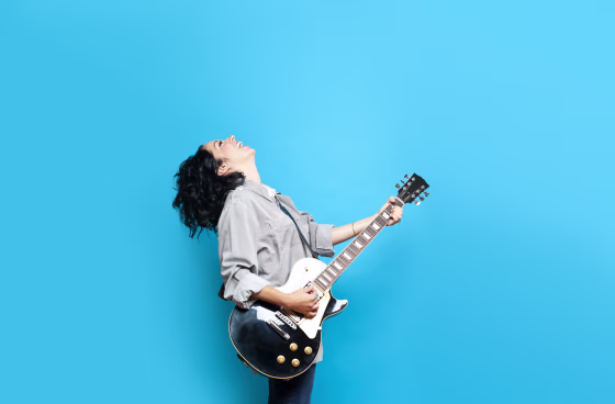 Image: Woman playing guitar