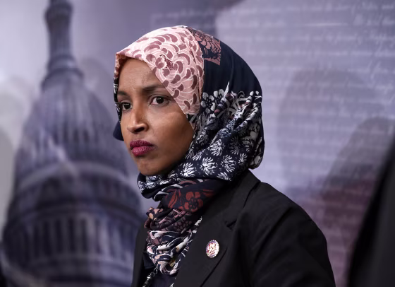 Image: Ilhan Omar (D-MN)  listens during a news conference on prescription drugs
