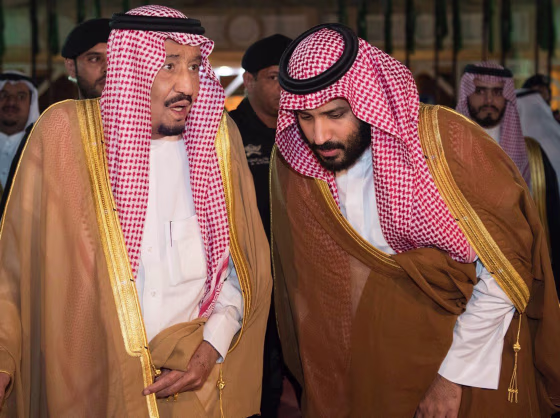 Image: Saudi Arabia's King Salman bin Abdulaziz Al Saud chats with his son and Crown Prince Mohammed bin Salman in Riyadh