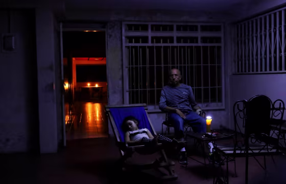 Image: People rest at their house during a blackout in Puerto Ordaz, Venezuela, on March 9, 2019.