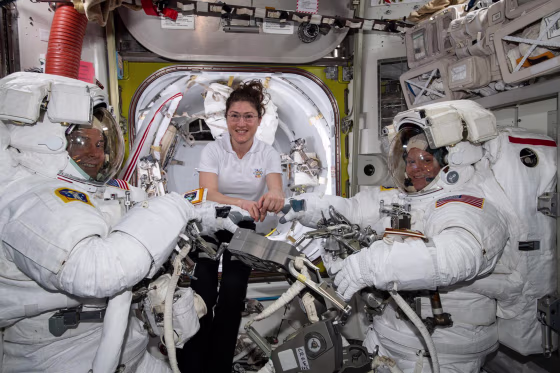 Image: NASA astronaut Christina Koch, center, assists fellow astronauts Nick Hague (left) and Anne McClain in their U.S. spacesuits shortly before they begin the first spacewalk of their careers