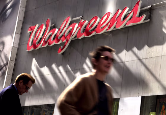 Image: People walk by a Walgreens in Times Square in New York on Oct. 17, 2012.