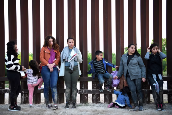 Image: Central American migrants turn themselves in to U.S. Border Patrol as they seek asylum after illegally crossing the Rio Grande near Penitas