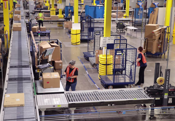 Workers pack and ship customer orders at a fulfillment center in Romeoville, Illinois, on Aug. 1, 2017