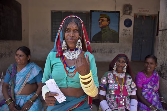 Image: An Indian Lambada tribal woman shows the indelible ink mark on her index finger after casting her vote at a polling booth during the first phase of general elections in Hyderabad, India