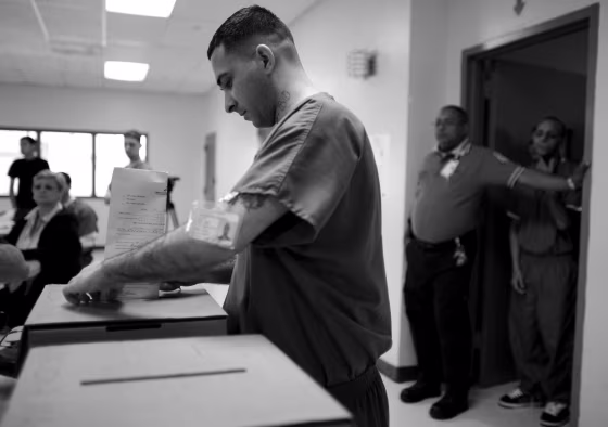 A Puerto Rican prison inmate casts his ballot, as prisoners voted two days early in the Democratic primary, at Correctional Institute 501, in Bayamon, Puerto Rico, on May 30, 2008.