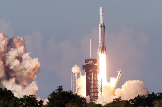 Image: A SpaceX Falcon Heavy rocket, carrying the Arabsat 6A communications satellite, lifts off from the Kennedy Space Center in Cape Canaveral Florida