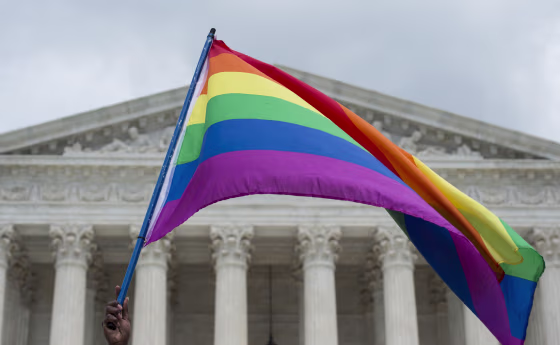 Image: A rainbow flag is flown outside the Supreme Court in Washington, DC
