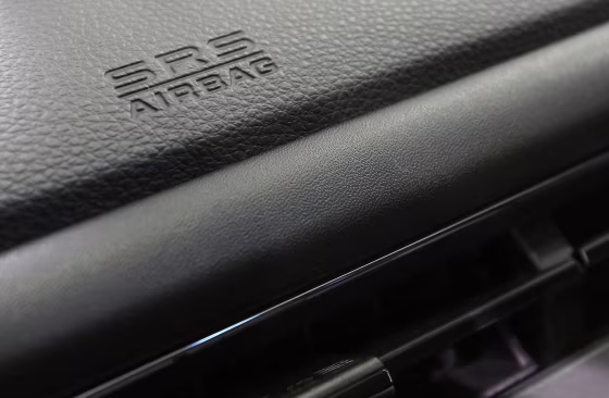 Image: An airbag logo on a dashboard of a Honda Motor Co's car displayed at the company's showroom.
