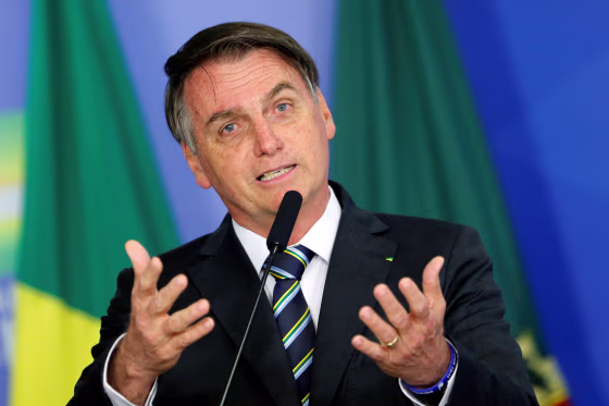 Image: Brazil's President Jair Bolsonaro speaks during a ceremony at the Planalto Palace in Brasilia