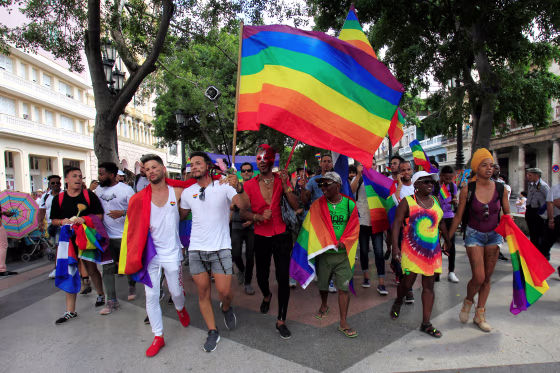Image: LGBT activists hold flags during a demonstration in Havana on May 11, 2019.
