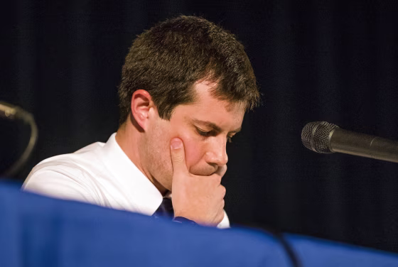 Image: Democratic presidential candidate and South Bend Mayor Pete Buttigieg looks down during a town hall community meeting