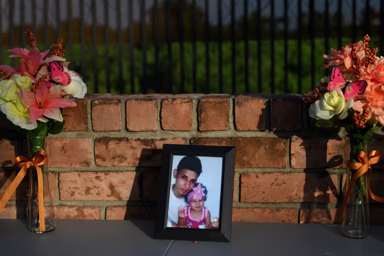Image: A photo of Oscar Alberto Martinez Ramirez and his 23-month-old daughter, Valeria, who drowned while crossing the Rio Grande, at a vigil in Brownsville, Texas, on June 30, 2019.