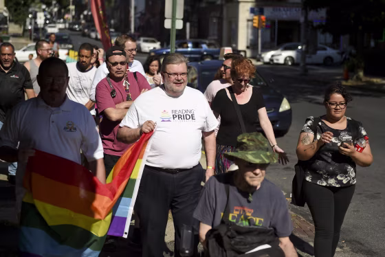 Ben Renkus carries a Pride Flag that was supposed to be raised over City Hall in Reading, Pennsylvania, on July 15, 2019.
