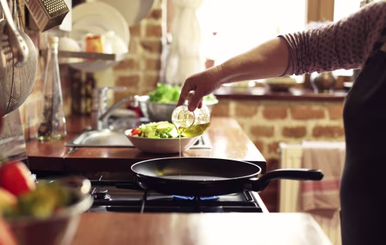 Image: Cooking vegetables, step four, pouring the olive oil