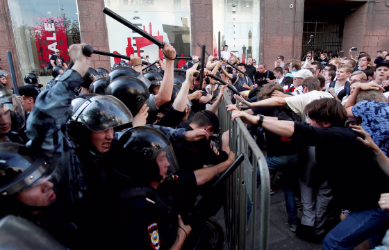 Image: Demonstrators clash with Russian police during a rally for election fairness in Moscow on July 27, 2019.