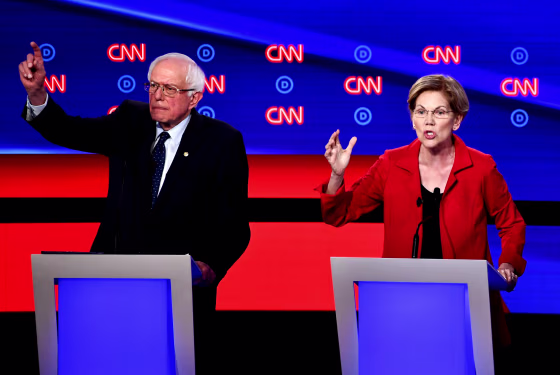 Image: Sens. Bernie Sanders and Elizabeth Warren speak during the first round of the second Democratic primary debate at the Fox Theatre in Detroit on July 30, 2019.